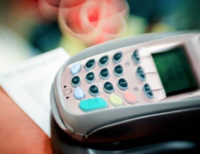 A picture of a payment terminal depicting outdated payment protocols exposing customers and merchants.