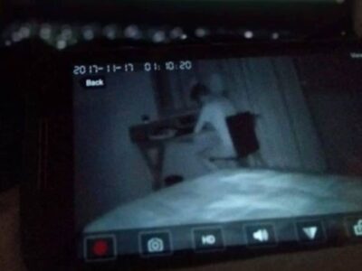 A picture of an exposed private camera showing a man in his room working attached to a blog article about how the cloud exposes private IP cameras.